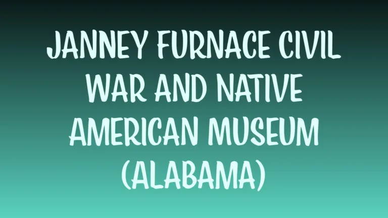 Janney Furnace Museum displays a large red brick furnace with historical plaques in a sunny outdoor setting.